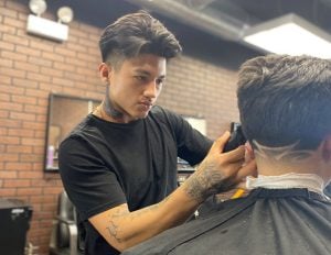 Barber working on a client.