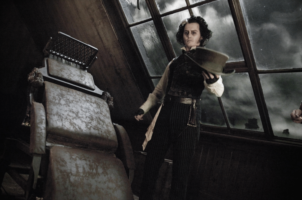Top Actors Who Have Played Barbers in Hollywood Movies 4 Johnny Depp as Sweeney Todd standing by barber chair in dark film scene