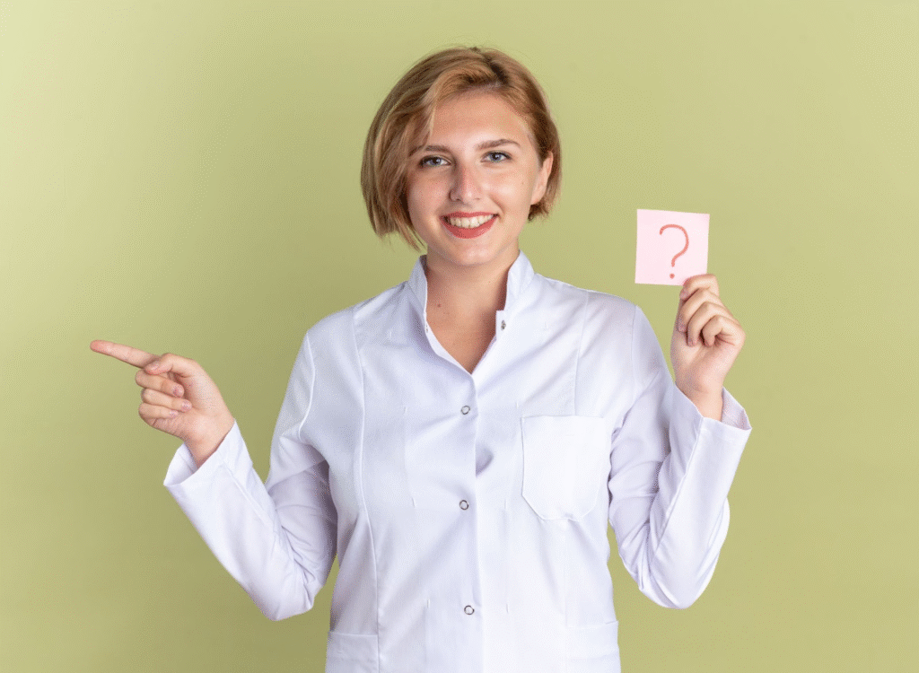 Cosmetologist vs. Esthetician vs. Barber: Choosing the Right Beauty Career Path 7 Smiling esthetician holding question mark card while pointing to decision making