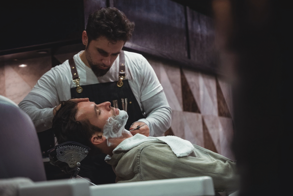 Top Paying Beauty Careers in Illinois 4 Barber in Illinois giving traditional straight razor shave