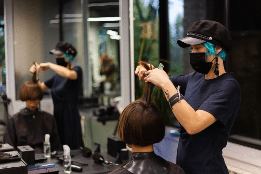 Top Paying Beauty Careers in Illinois 5 Professional hairstylist in Illinois cutting client’s hair in modern salon