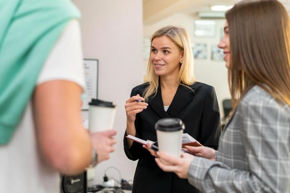 Hairstylist talking to her clients during a consultation.