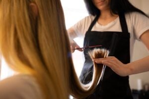 Hairstylist working at a professional hair salon.