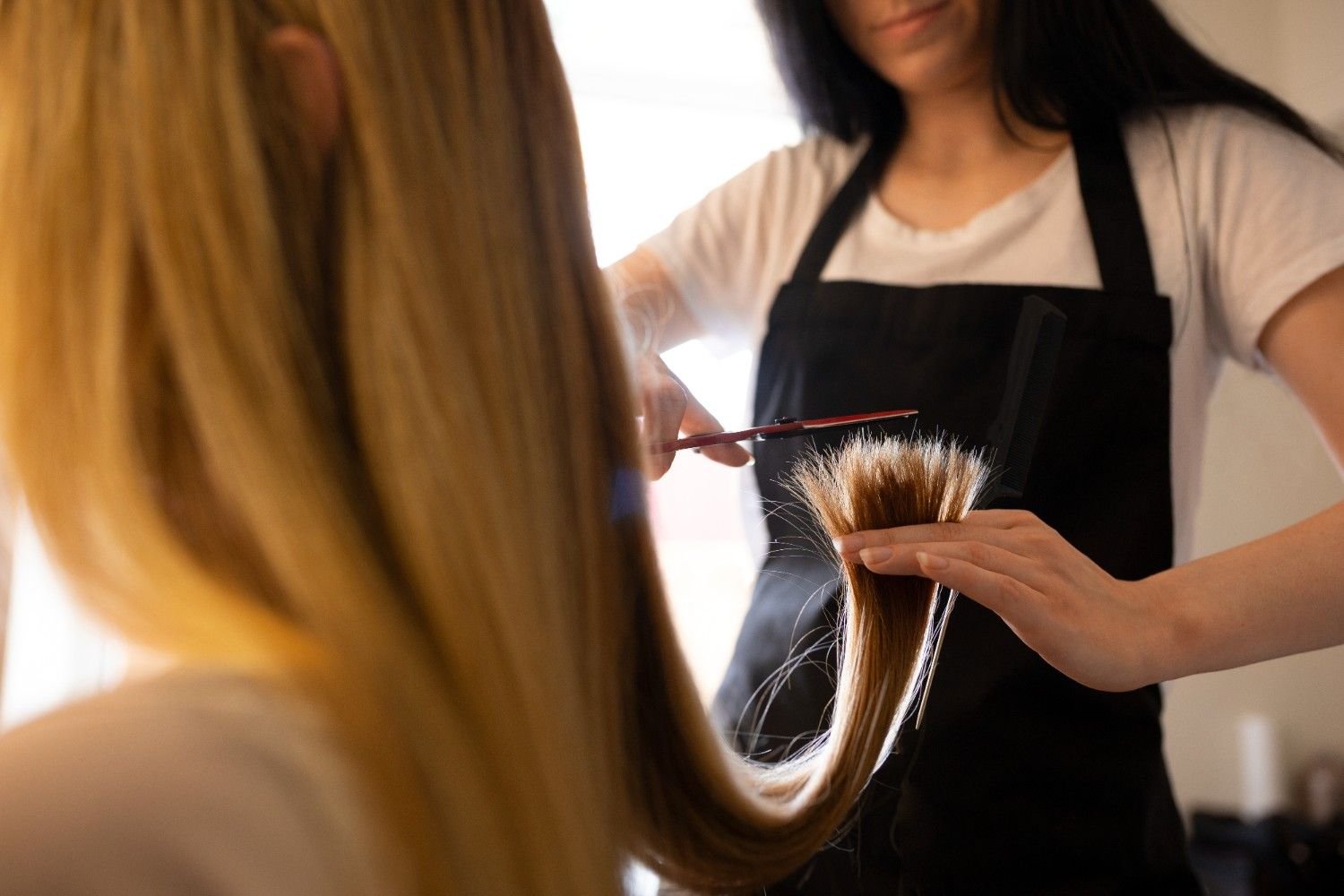 Hairstylist working at a professional hair salon.