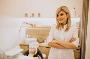 Licensed esthetician in a professional treatment room.