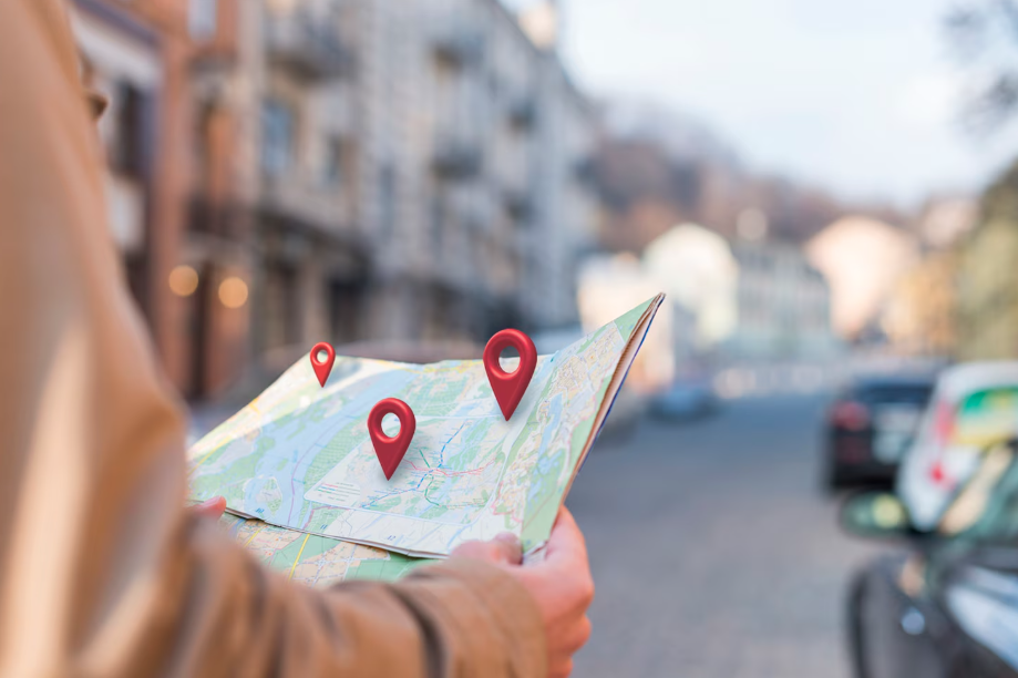 Person holding map with locations
