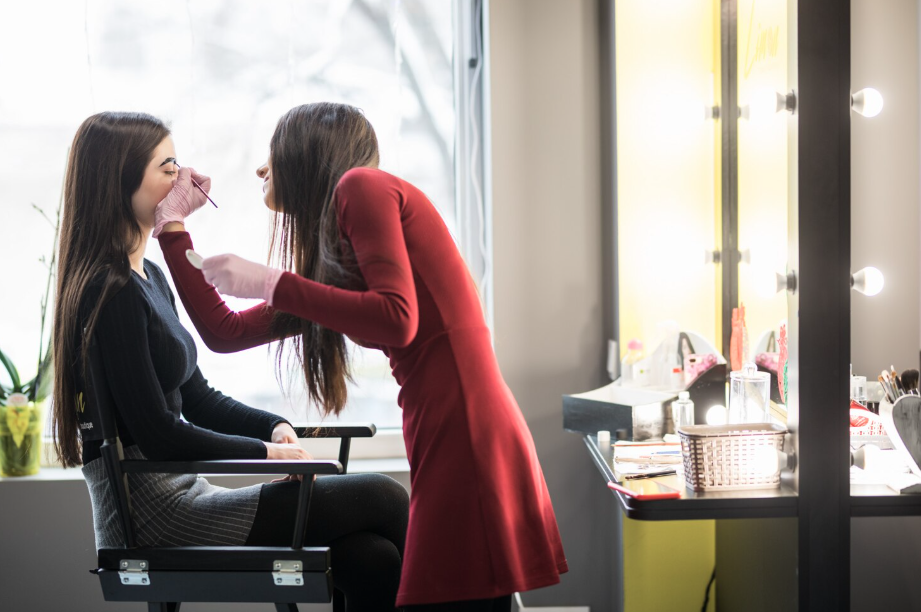 Makeup application in a salon.