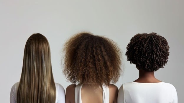 Comparison of straight, curly, and coily hair textures used in cosmetology training to understand hair types.