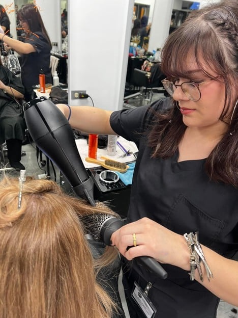 student at Cosmetology & Spa Academy one of the best cosmetology schools in Illinois